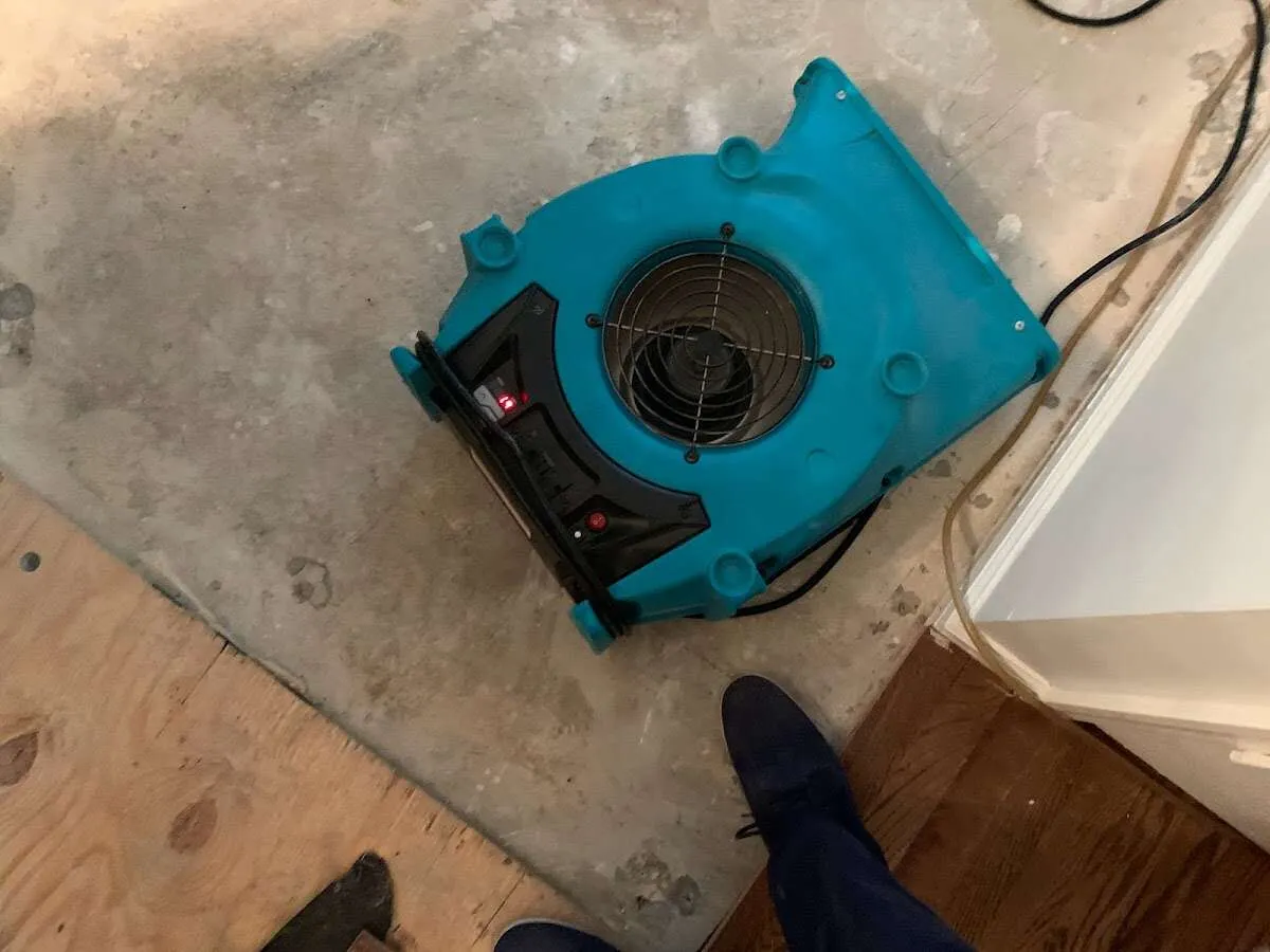 Air mover drying subfloor during Leak Detection & Repair in Lewistown